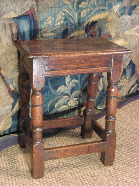 A jointed stool with sophisticated joints. It was made by a joiner rather than a carpenter.
