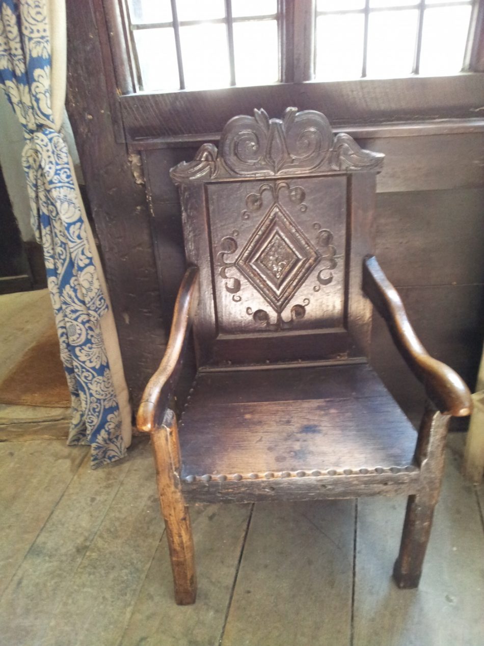 A carved armchair.
