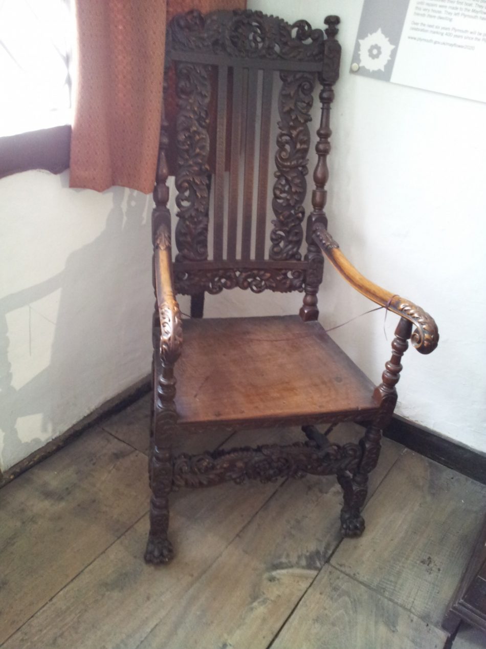An elaborate carved chair.
