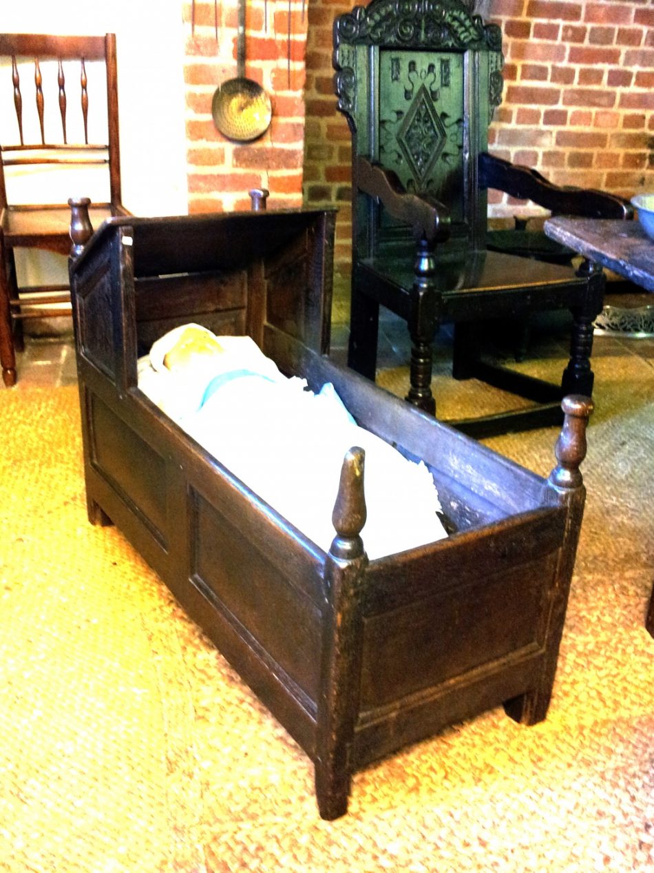A small child's bed without rockers.
